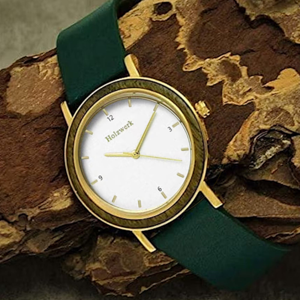 Holzwerk JENA Damenuhr mit 38 mm Gehäuse in Gold und Braun sowie weiß-goldenem Ziffernblatt und grünem Lederarmband, Seitenlage links